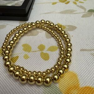 Gold Beaded Bracelet with Polished Finish and Distinct Bead Sizes